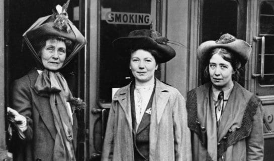 A portrait of the leader of the Women's Suffragette movement, Mrs Emmeline Pankhurst (left) and her daughters Christabel (centre) and Sylvia (right) at Waterloo Station, London. Mrs Pankhurst was about to leave for a lecture tour of the USA and Canada.