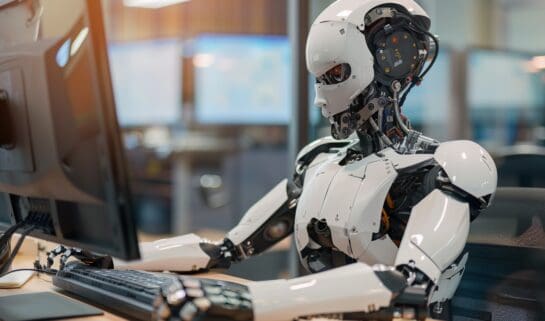 Hi Tech robot working at a computer